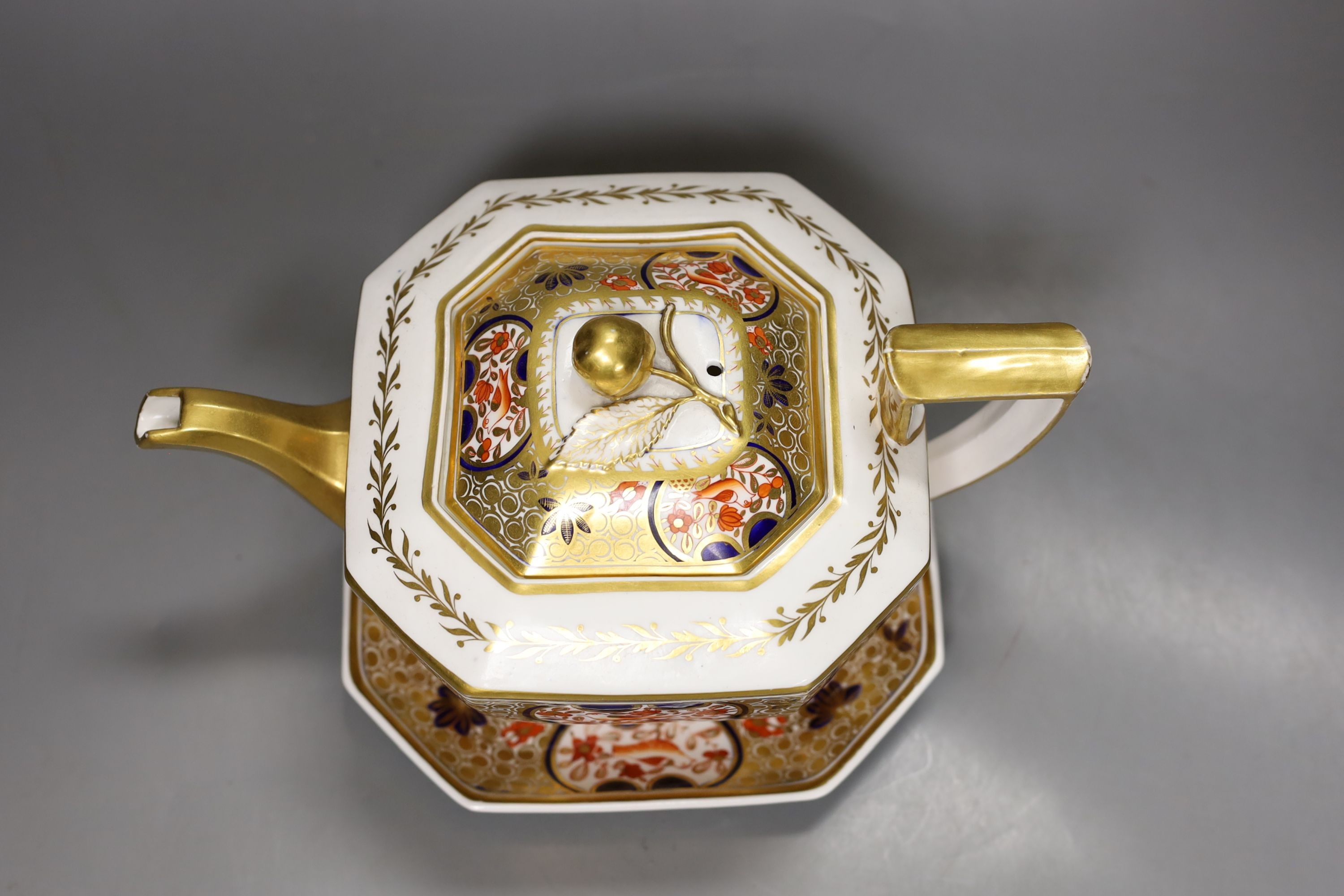 A Spode teapot cover and stand painted with Imari pattern, 1495, c.1820, 24.5 cm long